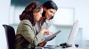 Two Businesswomen with computer in an office.
